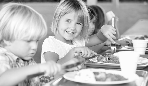 ElementaryPupilsEnjoyingHealthyLunchInCafeteria.jpg